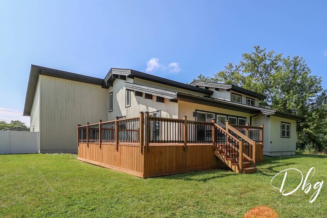 Wide view of a completed rear deck and stairs